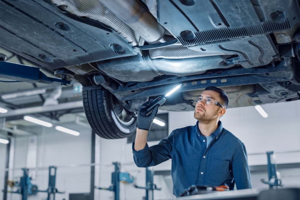 remove plastic holding underbody of car